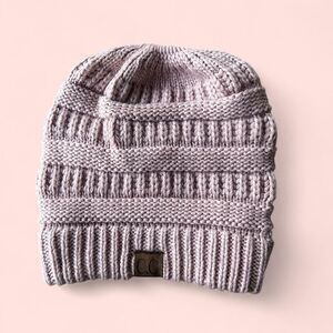Pink knit beanie with a ponytail hole